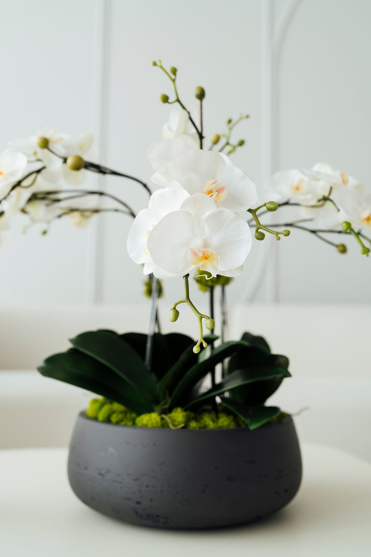 Soie Amour artificial flowers Orchids in Medium Dark Gray Vase with white blooms